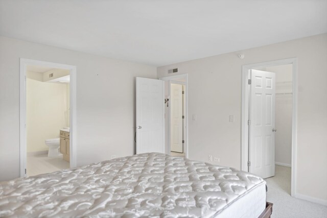 59 S Hale St Unit 402, Palatine, IL 60067 - bedroom with a walk in closet, light colored carpet, a closet, and ensuite bathroom