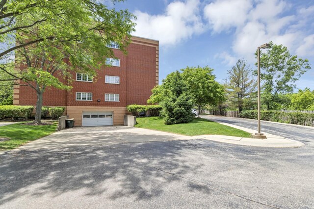 59 S Hale St Unit 402, Palatine, IL 60067 - view of building exterior with a garage and driveway