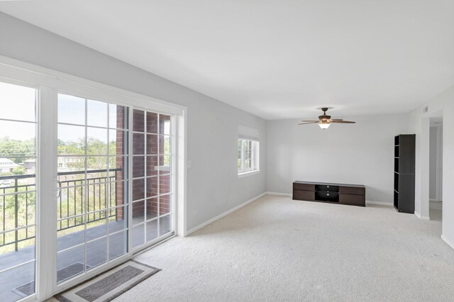 59 S Hale St Unit 402, Palatine, IL 60067 - unfurnished living room featuring carpet floors and a ceiling fan