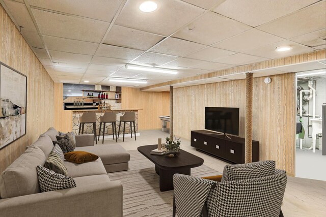 4445 Grove Ave, Stickney, IL 60402 - living area featuring wooden walls, bar, and a drop ceiling