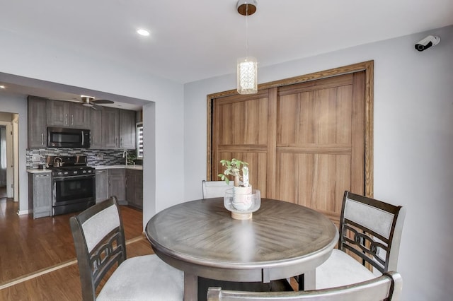 4445 Grove Ave, Stickney, IL 60402 - dining room with dark wood finished floors, ceiling fan, and recessed lighting