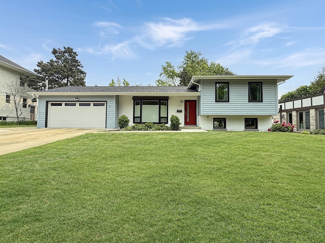 389 Forest Ave, Glen Ellyn, IL 60137 - split level home with a garage, a front yard, and concrete driveway