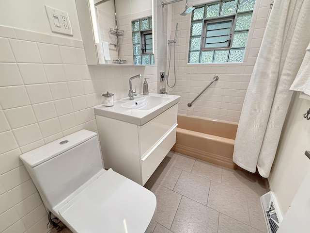 389 Forest Ave, Glen Ellyn, IL 60137 - full bath featuring shower / tub combo, vanity, tile walls, and tile patterned floors