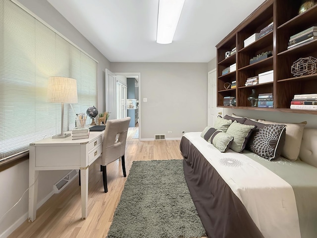 389 Forest Ave, Glen Ellyn, IL 60137 - bedroom with light wood-style floors and baseboards