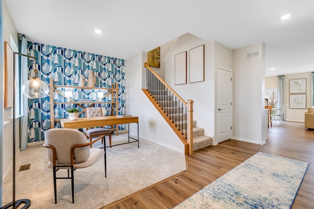 520 N Sycamore St, Hinckley, IL 60520 - dining space with wood finished floors, stairway, and recessed lighting