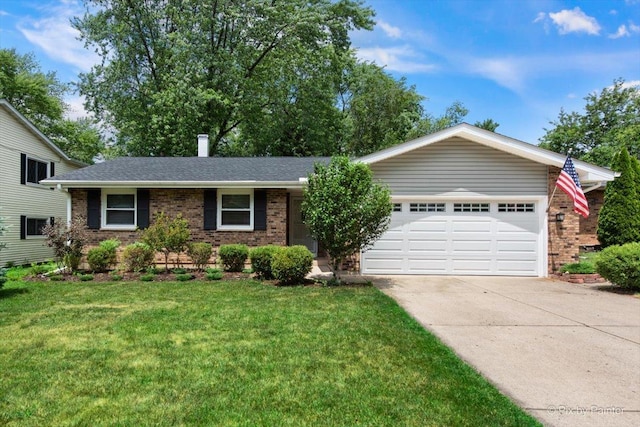 862 Arthur Dr, Elgin, IL 60120 - view of front facade featuring brick siding, an attached garage, driveway, and a front lawn