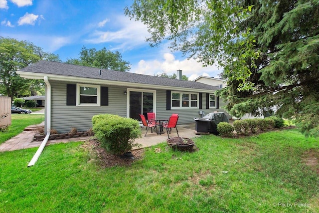 862 Arthur Dr, Elgin, IL 60120 - rear view of property featuring a yard, a patio, and an outdoor fire pit