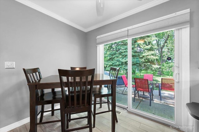 862 Arthur Dr, Elgin, IL 60120 - dining room with light wood-style floors and crown molding