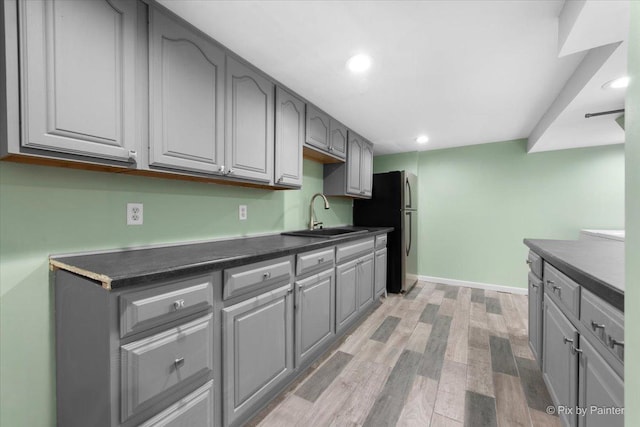 862 Arthur Dr, Elgin, IL 60120 - kitchen featuring freestanding refrigerator, gray cabinets, light wood-style floors, dark countertops, and recessed lighting
