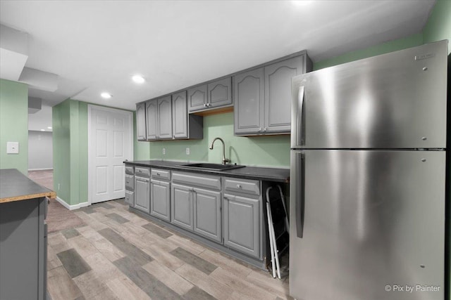 862 Arthur Dr, Elgin, IL 60120 - kitchen with freestanding refrigerator, gray cabinetry, dark countertops, light wood-style flooring, and recessed lighting
