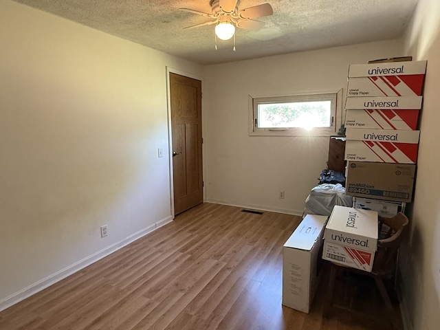 2705 Pine St, Rock Falls, IL 61071 - spare room with a textured ceiling, wood finished floors, and ceiling fan