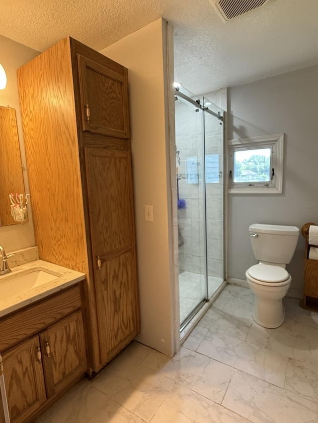 2705 Pine St, Rock Falls, IL 61071 - bathroom with vanity, a textured ceiling, marble look tiles, and a shower stall