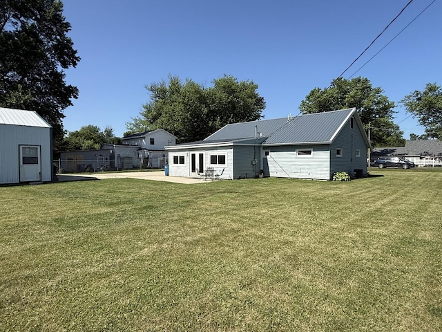 2705 Pine St, Rock Falls, IL 61071 - back of house featuring a patio and a metal roof