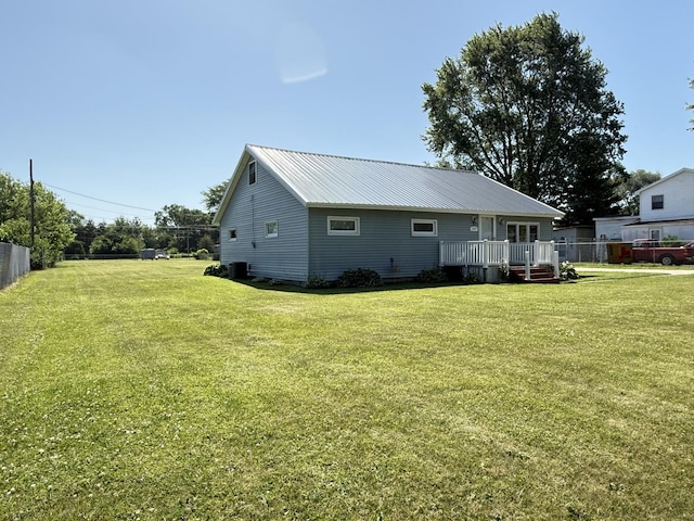 2705 Pine St, Rock Falls, IL 61071 - back of house with a wooden deck and a metal roof