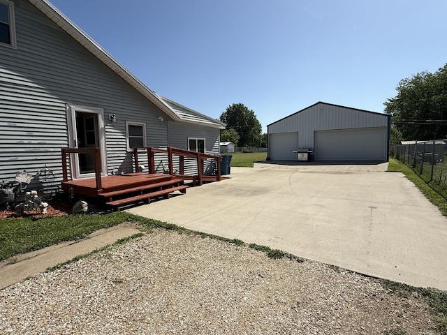 2705 Pine St, Rock Falls, IL 61071 - view of home's exterior featuring a detached garage, a deck, and an outdoor structure