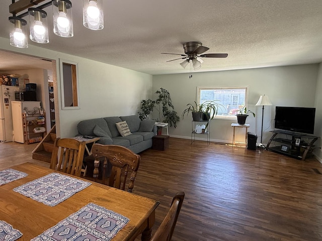 2705 Pine St, Rock Falls, IL 61071 - dining room with a ceiling fan, wood finished floors, and a textured ceiling