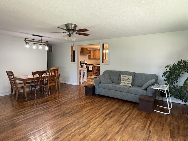 2705 Pine St, Rock Falls, IL 61071 - living room with wood finished floors, a ceiling fan, and a textured ceiling