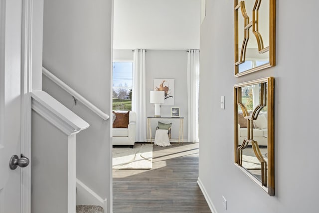 989 Amethyst Ln, Montgomery, IL 60538 - hallway featuring dark wood-type flooring and baseboards
