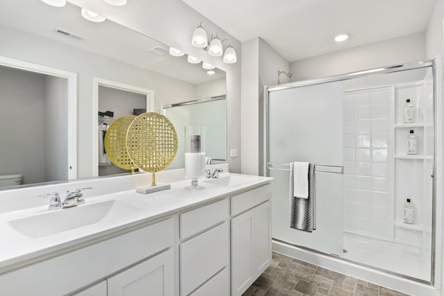 989 Amethyst Ln, Montgomery, IL 60538 - full bathroom featuring a shower stall, double vanity, and recessed lighting