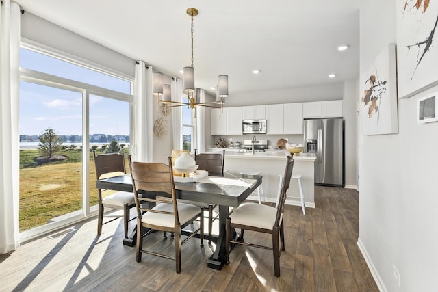 989 Amethyst Ln, Montgomery, IL 60538 - dining area with dark wood-style flooring, a chandelier, and recessed lighting