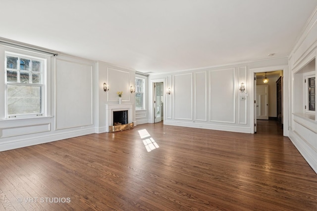 1120 Forest Ave, Evanston, IL 60202 - unfurnished living room with a decorative wall, plenty of natural light, wood finished floors, and a fireplace