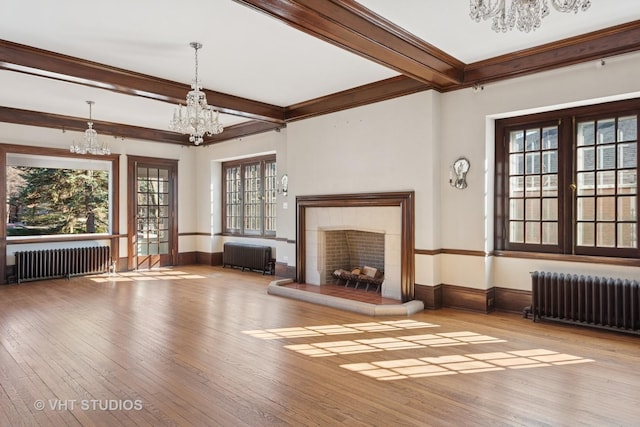 1120 Forest Ave, Evanston, IL 60202 - unfurnished living room featuring radiator heating unit, a chandelier, wood-type flooring, crown molding, and beamed ceiling