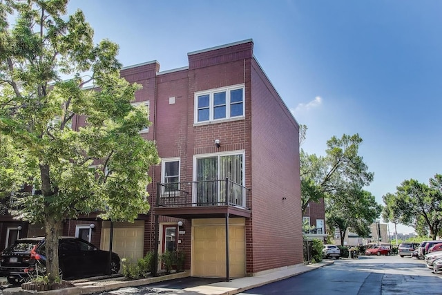 1728 W Terra Cotta Pl Unit D, Chicago, IL 60614 - view of building exterior with a garage