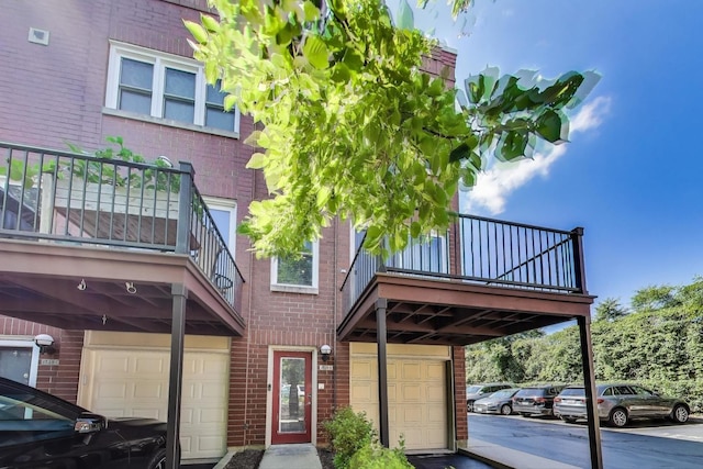 1728 W Terra Cotta Pl Unit D, Chicago, IL 60614 - exterior space with a balcony, brick siding, and a garage