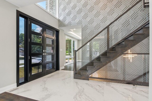 3933 Gloria Ct, Glenview, IL 60025 - foyer entrance featuring a towering ceiling, marble tiled flooring, and stairs