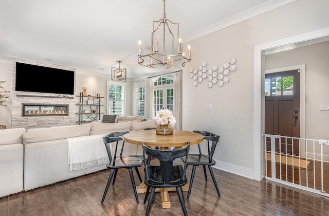 26 S Chestnut Ave, Arlington Heights, IL 60005 - dining space with dark wood-type flooring, plenty of natural light, a chandelier, a fireplace, and crown molding