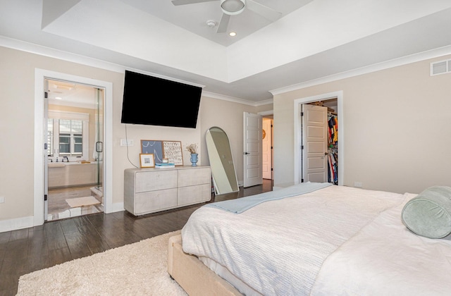 26 S Chestnut Ave, Arlington Heights, IL 60005 - bedroom featuring wood finished floors, a walk in closet, a raised ceiling, ornamental molding, and ensuite bath