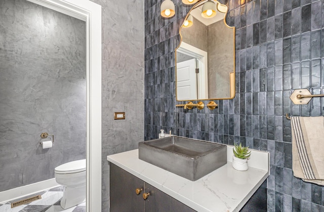 26 S Chestnut Ave, Arlington Heights, IL 60005 - half bath featuring tile walls, marble look tile flooring, and vanity