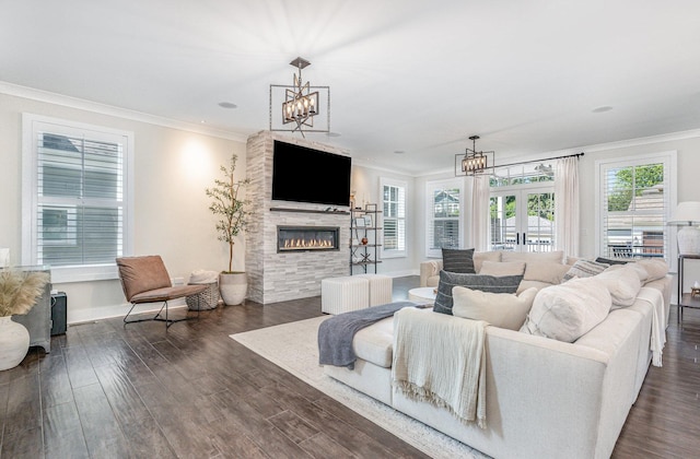26 S Chestnut Ave, Arlington Heights, IL 60005 - living room featuring a fireplace, crown molding, dark wood-style floors, and a chandelier