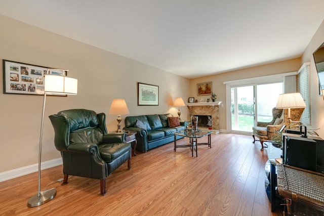 211 Winding Oak Ln, Buffalo Grove, IL 60089 - living room featuring light wood finished floors and a tiled fireplace