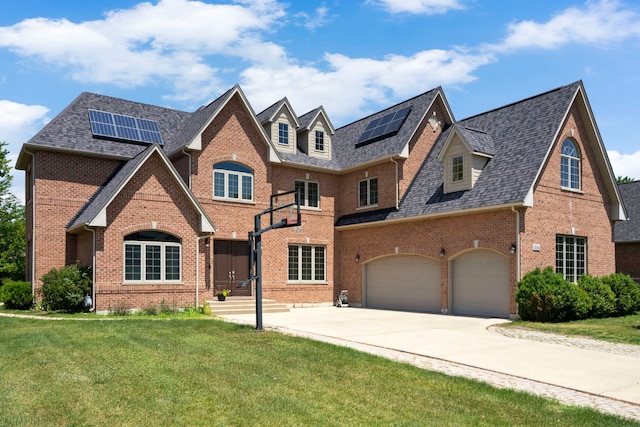4146 Cardinal Ct, Northbrook, IL 60062 - view of front of house with brick siding, roof mounted solar panels, a front yard, and driveway