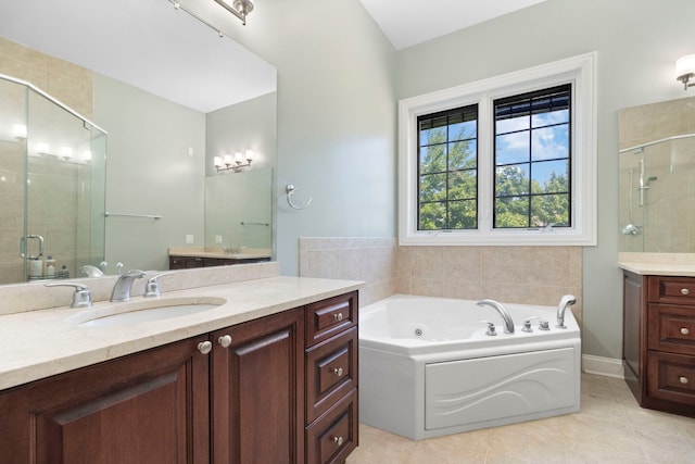4146 Cardinal Ct, Northbrook, IL 60062 - full bath with vanity, a stall shower, a jetted tub, and tile patterned flooring