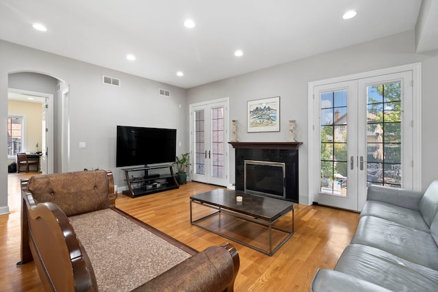 4146 Cardinal Ct, Northbrook, IL 60062 - living area with french doors, arched walkways, wood finished floors, and recessed lighting