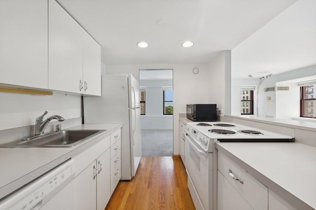 40 E 9th St Unit 802, Chicago, IL 60605 - kitchen featuring white appliances, light wood-type flooring, light countertops, white cabinets, and recessed lighting