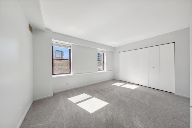 40 E 9th St Unit 802, Chicago, IL 60605 - unfurnished bedroom with light carpet and a closet