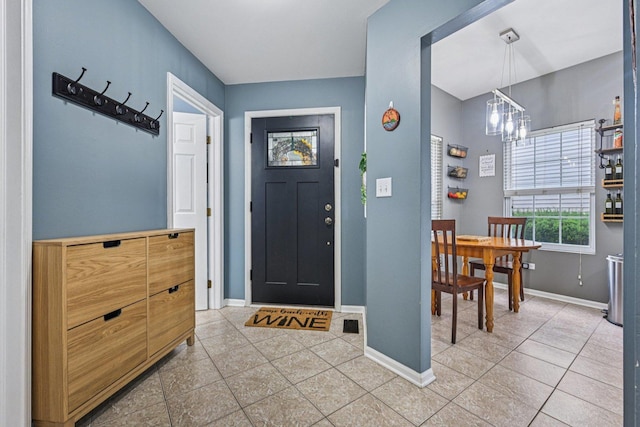 1021 Horizon Rdg, Lake In The Hills, IL 60156 - foyer featuring light tile patterned floors and a chandelier
