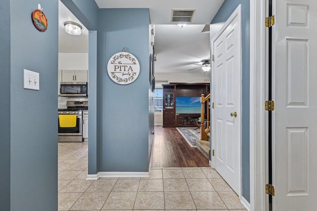 1021 Horizon Rdg, Lake In The Hills, IL 60156 - hallway featuring tile patterned flooring and baseboards