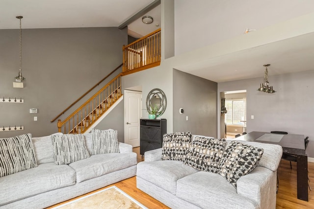80 Wilton Ln, Mundelein, IL 60060 - living room with wood finished floors, high vaulted ceiling, stairway, and beamed ceiling