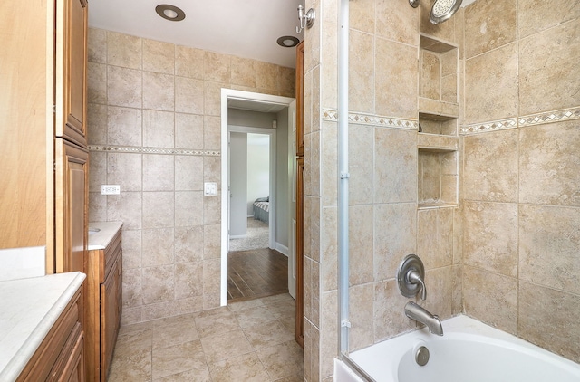 18W761 83rd St, Downers Grove, IL 60516 - bathroom featuring tile walls, bathing tub / shower combination, vanity, and tile patterned floors