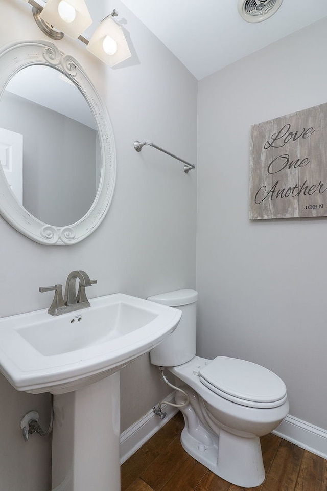 18W761 83rd St, Downers Grove, IL 60516 - half bathroom featuring toilet and wood finished floors
