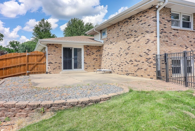 18W761 83rd St, Downers Grove, IL 60516 - back of property featuring brick siding, a patio, and a gate