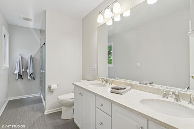 1580 W N St, Palatine, IL 60067 - bathroom featuring a stall shower, double vanity, and wood finished floors