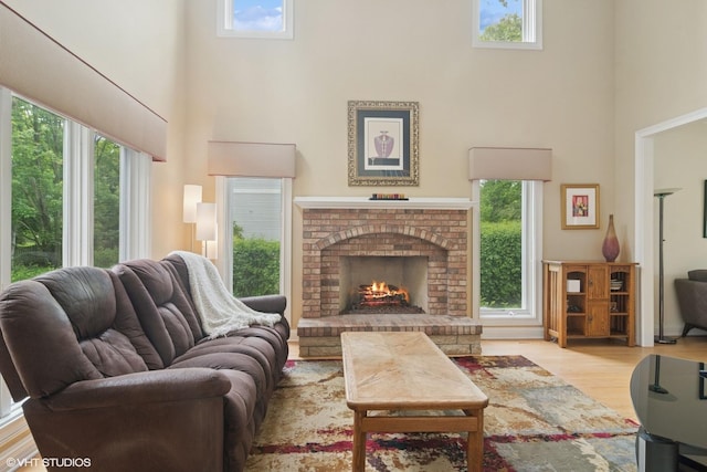 1580 W N St, Palatine, IL 60067 - living area featuring a towering ceiling, wood finished floors, plenty of natural light, and a fireplace