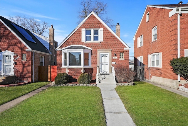 8416 S Bennett Ave, Chicago, IL 60617 - view of front of property with entry steps, brick siding, and a chimney
