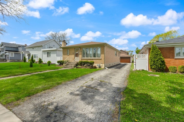 4850 N Clifton Ave, Norridge, IL 60706 - view of front of house featuring brick siding, a front yard, and a chimney