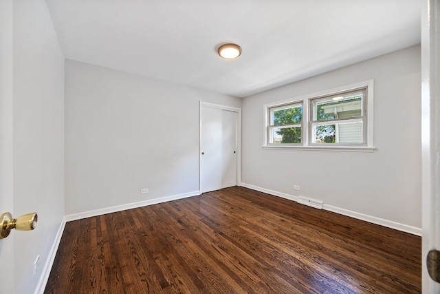 4850 N Clifton Ave, Norridge, IL 60706 - unfurnished bedroom featuring dark wood-type flooring and a closet